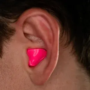 Custom solid earplug molded and worn in the ear