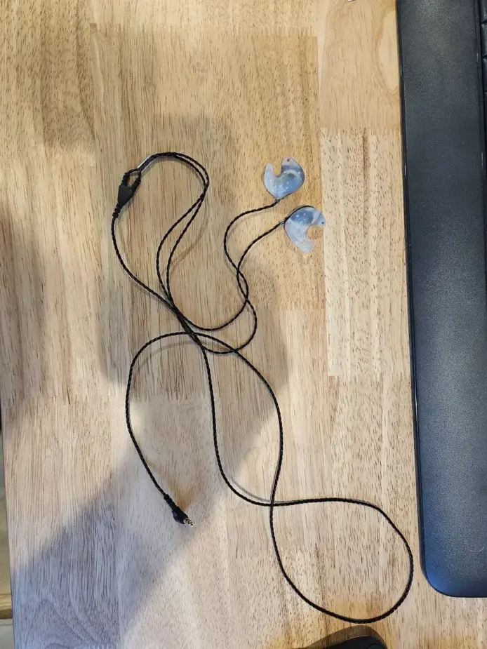 Big Ear soft-shell custom IEMs with the detachable cable coiled