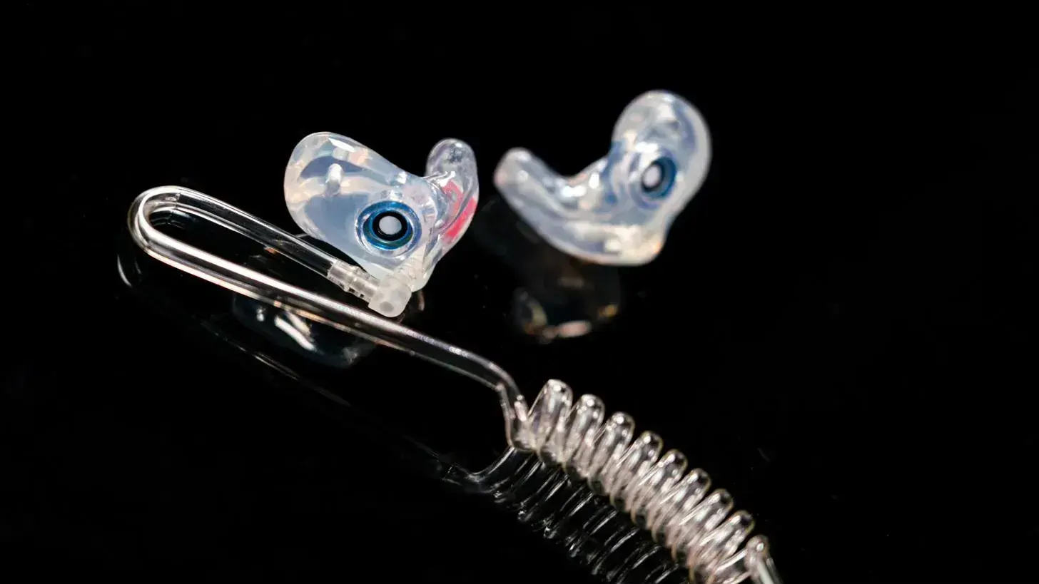 Custom marching band earplugs on a cord