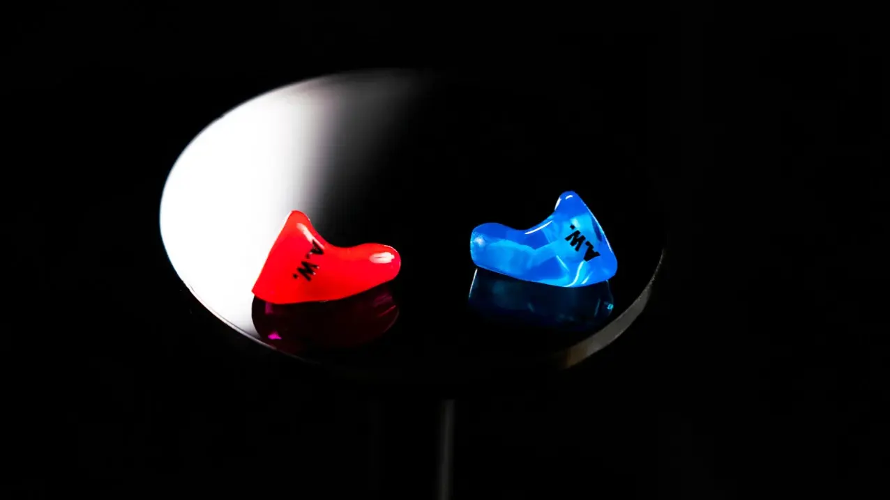 Red and blue custom CEP adapters on a pedestal