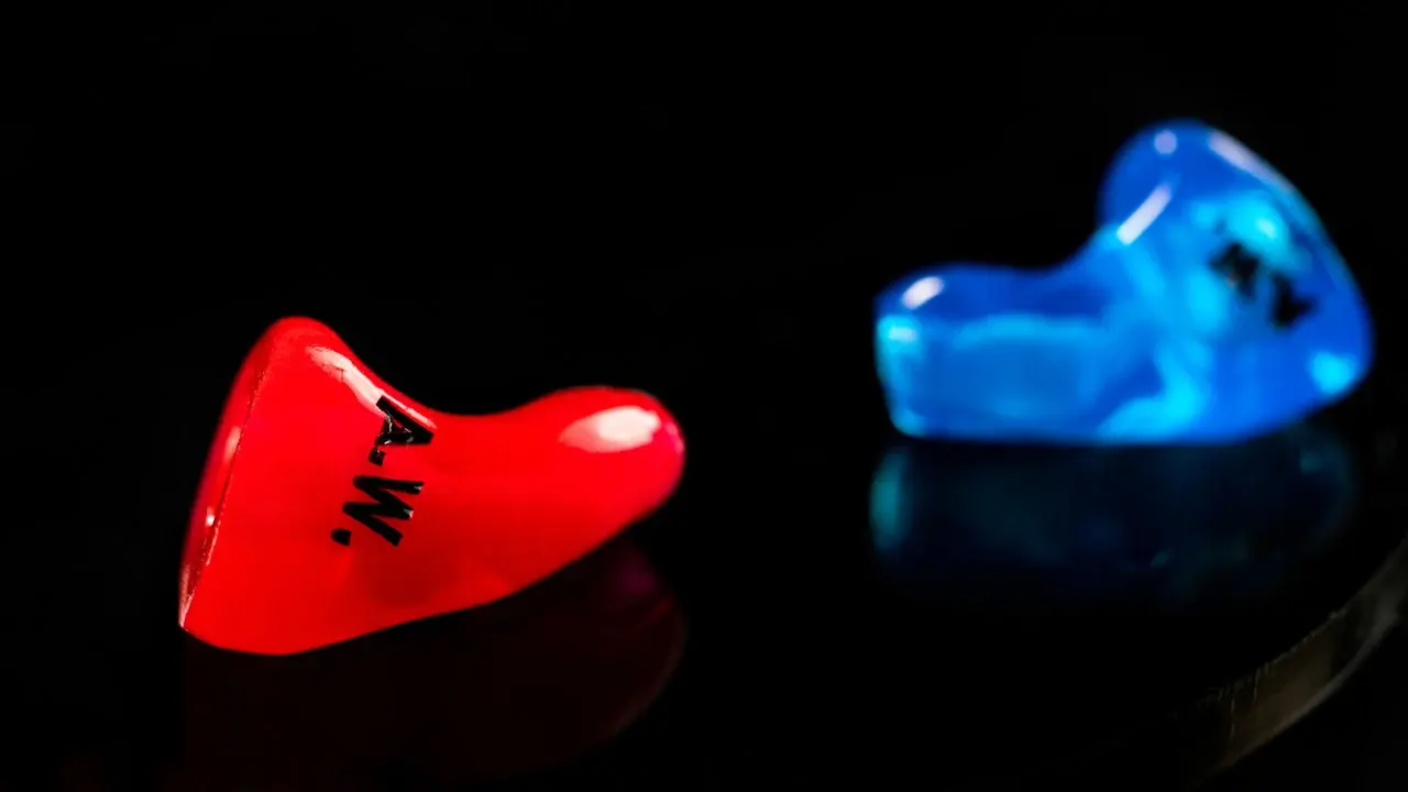 A red custom CEP adapter, studio macro on black