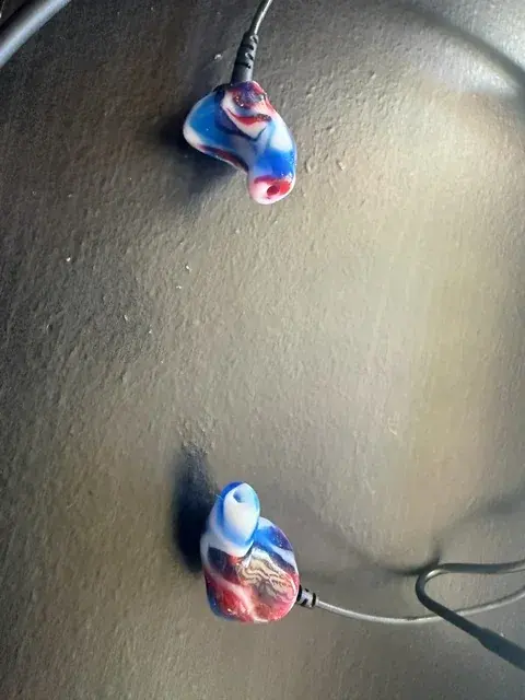 A pair of red, white and blue swirl custom Clarity Aloft adapters