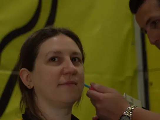 A Big Ear technician positions the impression material at the ear