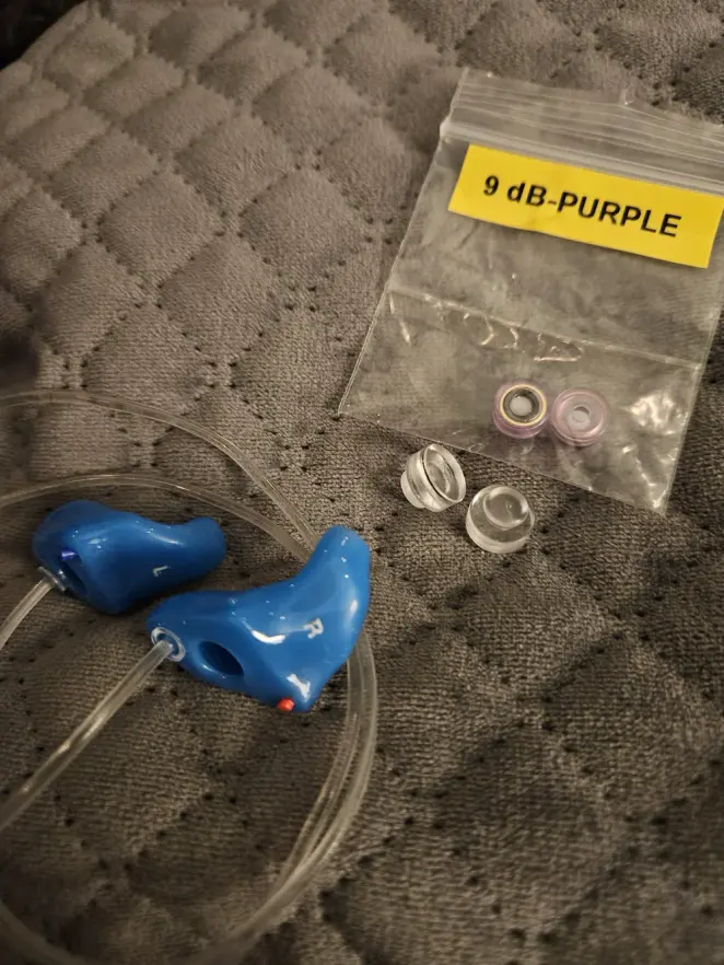 Blue custom The One earplugs with interchangeable 9 dB filters